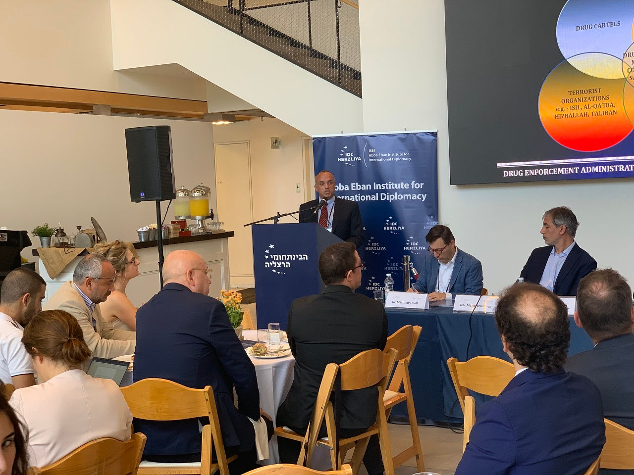 Speaker and panelists at a Washington Institute event