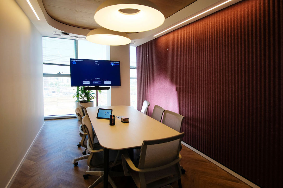 Modern meeting room with large screen and table