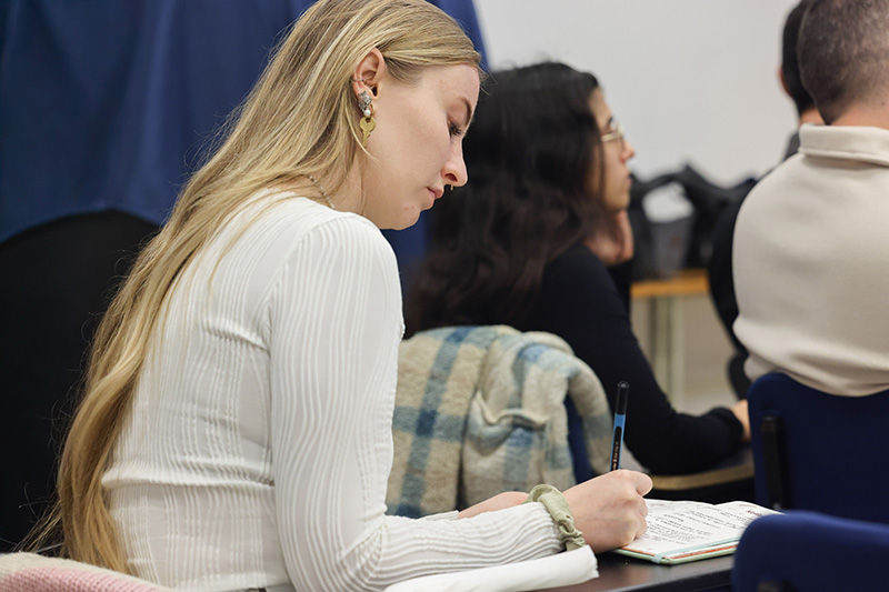 Young woman taking notes
