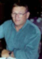 Portrait of a man in teal shirt