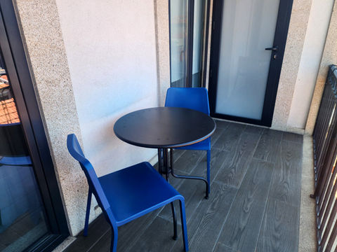 Balcony with table and chairs