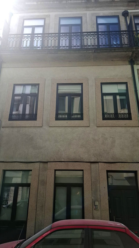 Three windows in a Porto building