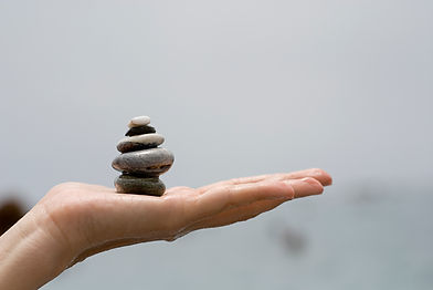 hand-holding-pile-stones.jpg