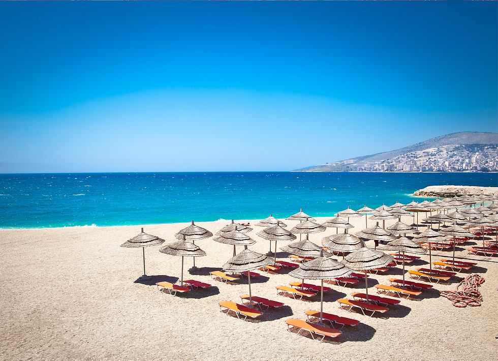 parasol and sunbeds on the beach mango beach in Saranda