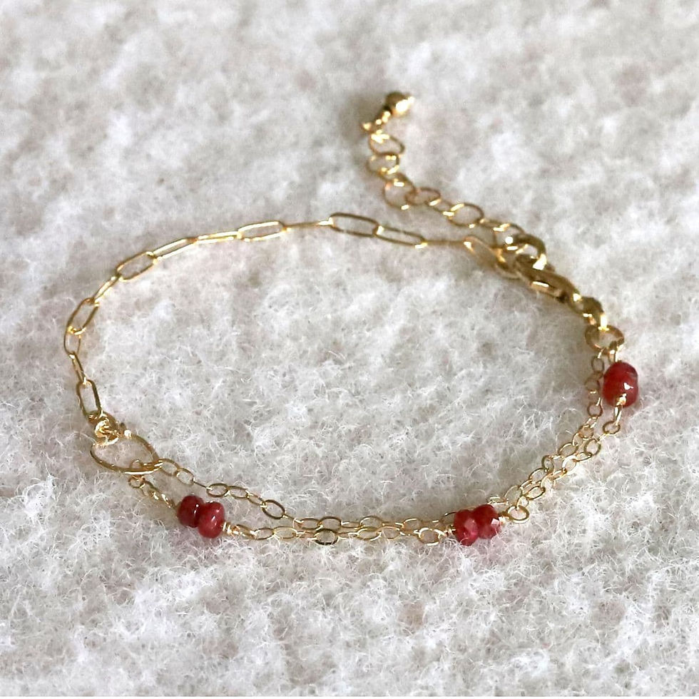 14k gold-filled chain bracelet with natural Ruby beads on a white background, artisan details of mixed chains and secure closure, elegant minimalist design from Shokoro Handmade, Toronto, ON, Canada.