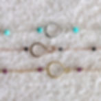 High-quality view of a hand-assembled Infinity Birthstone Bracelets with dainty chains, artisan made by Shokoro in Canada.