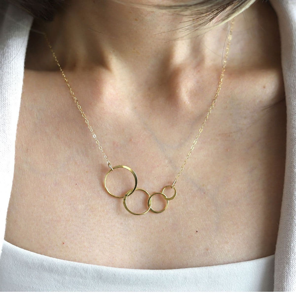 Minimalist gold vermeil interlocking four circle necklace from Shokoro Handmade, styled for an elegant everyday look.
