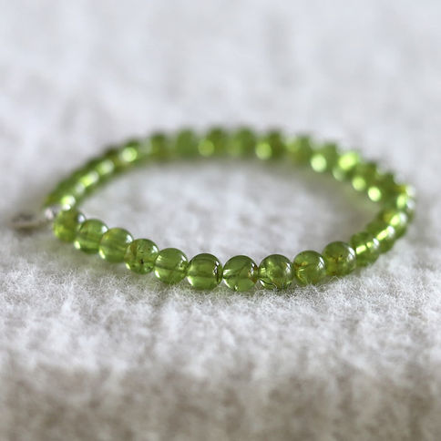 Natural 6mm Peridot healing bracelet. Minimalist high-quality spiritual crystal jewelry Shokoro Toronto.
