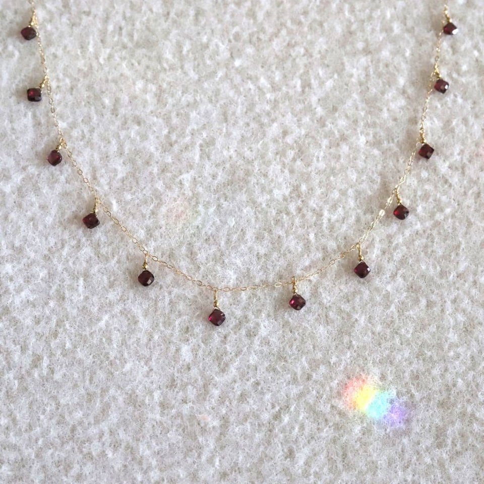 Delicate high-quality garnet station necklace, handcrafted birthstone piece for layering energy and intention by Shokoro.