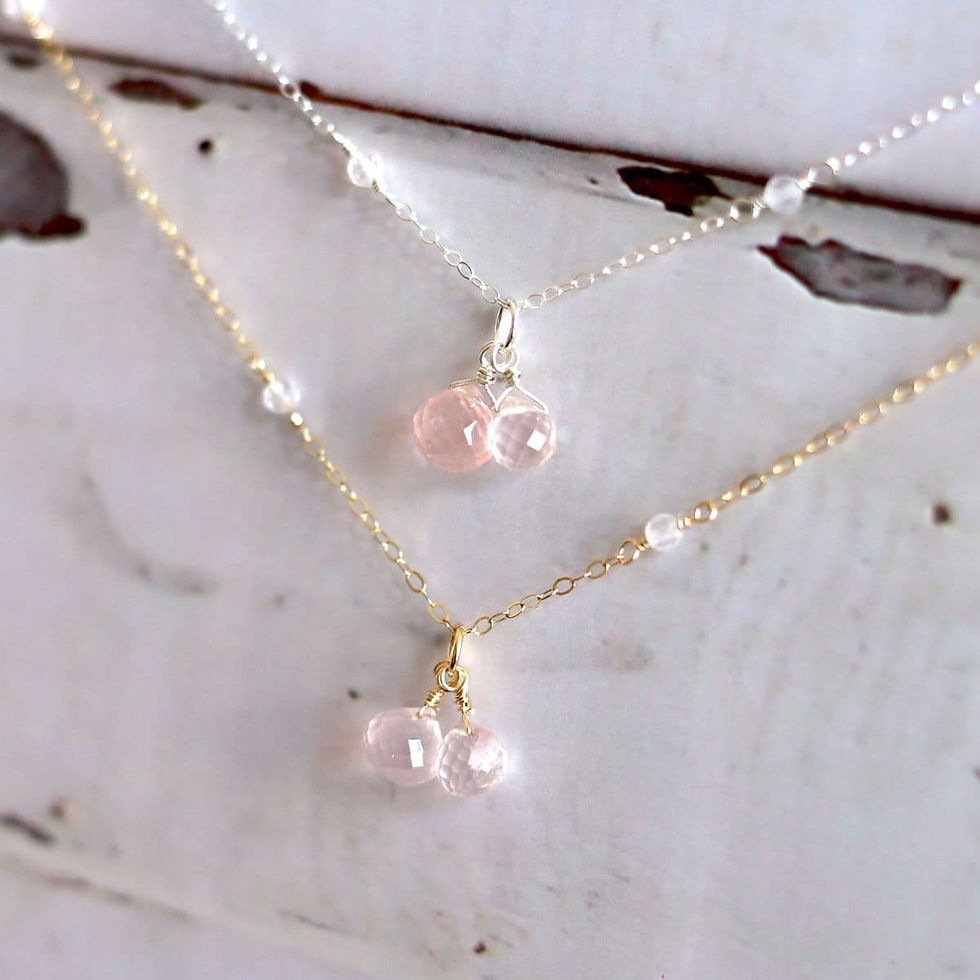 Angled close-up of handcrafted Rose Quartz station necklace showing faceted 3mm beaded chain and puffy gemstone drops by Shok