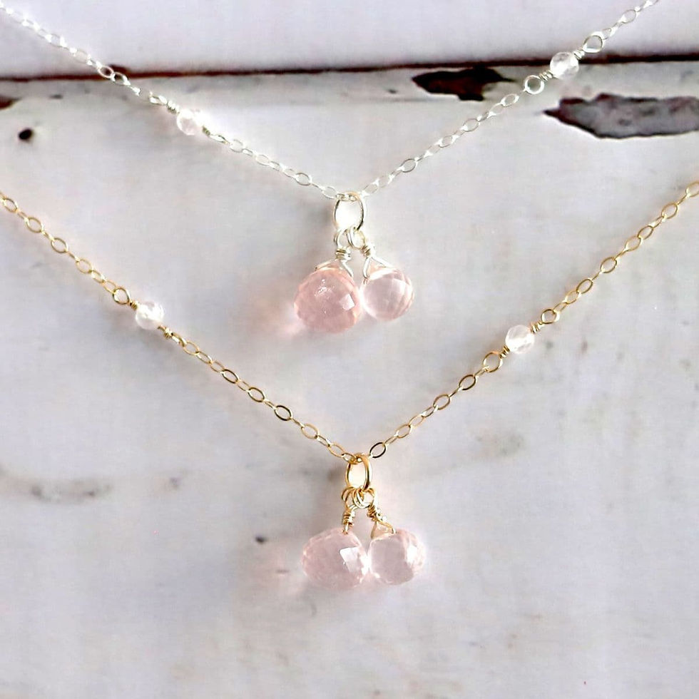 Front view of Rose Quartz station drop necklace in 14k gold filled with 10mm and 8mm puffy heart drops by Shokoro