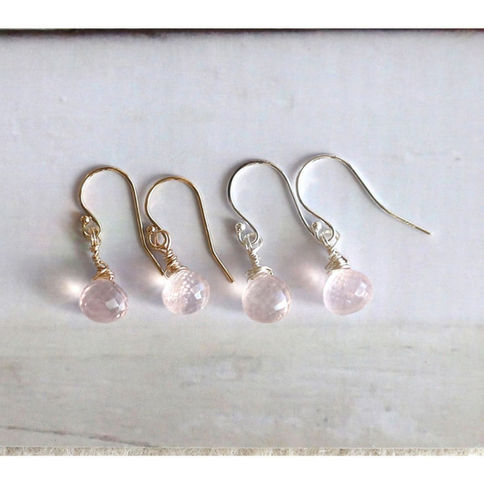 Front view of handcrafted Rose Quartz drop earrings on a rustic background, high-quality 14k gold filled and sterling silver.