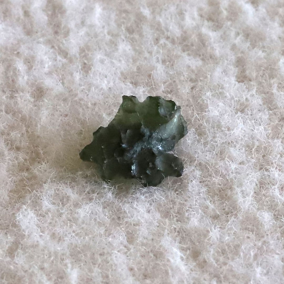 Raw Moldavite stone from the Shokoro Handmade collection, illustrating the natural healing properties and intention for protection and transformation.