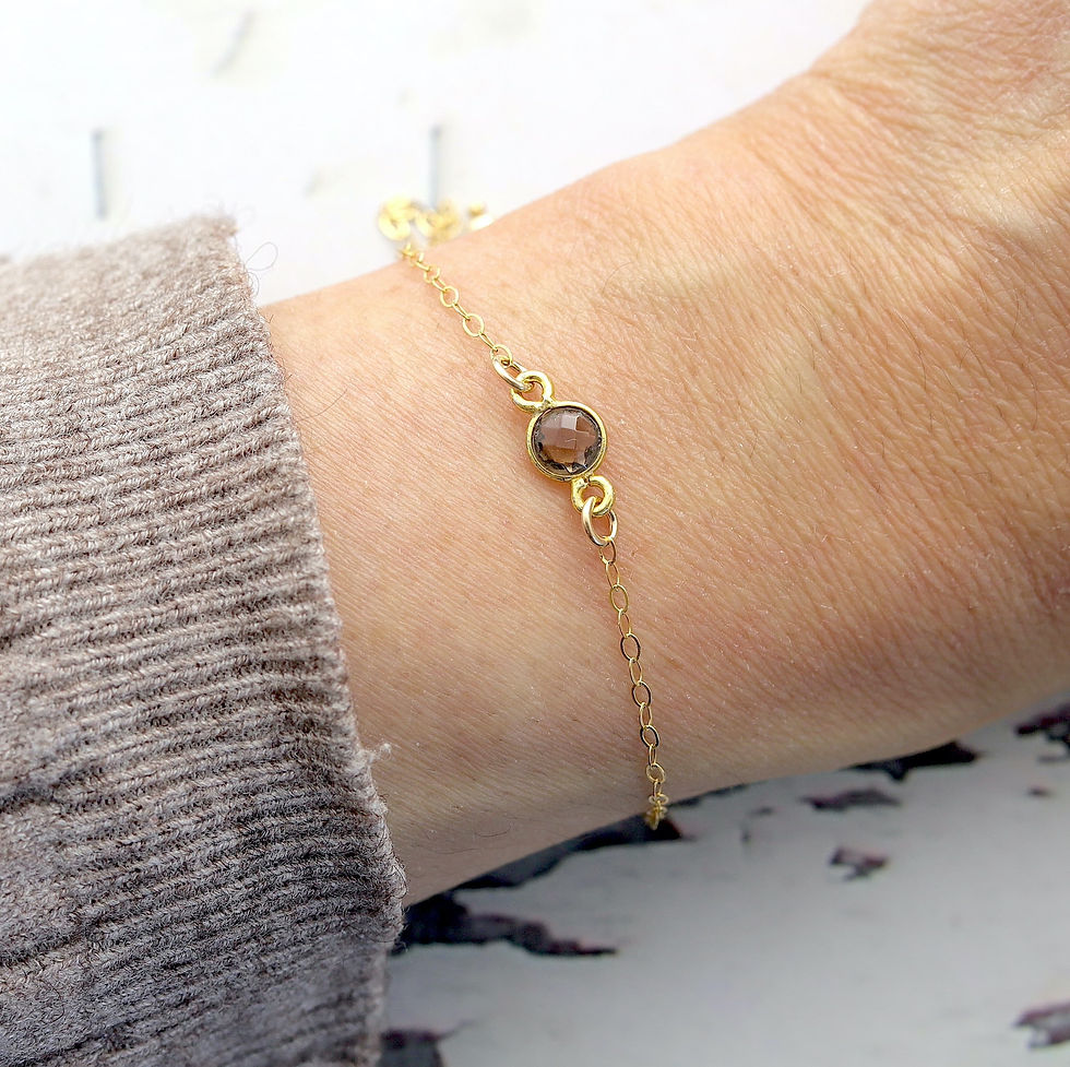 Close-up worn a smoky quartz gold bracelet, Feminine and elegant look, Perfect delicate natural birthstone jewelry