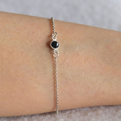 Close-up of delicate Black Onyx crystal bracelet. Sterling silver dainty jewelry handcrafted in Toronto, Ontario, Canada.