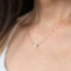 Gemini Air sign heart minimalist necklace on model. Dainty 14k gold filled layering choker Shokoro Handmade Canada.