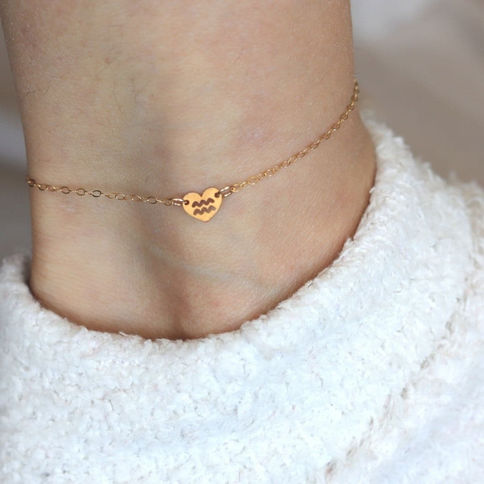 High-quality 14k gold-filled Aquarius zodiac heart anklet with delicate chain, handcrafted for minimalist elegance in Toronto