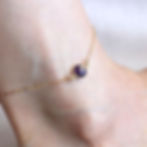 14k gold filed bezel set anklet with amethyst gemstone on foot. Delicate natural gemstone jewelry for Summer, Shokoro Canada.