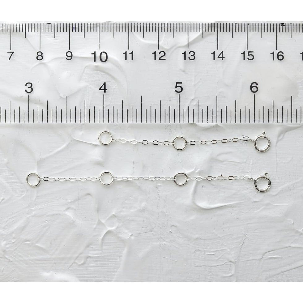 .925 sterling silver necklace extender next to a ruler to show exact length, handmade from Shokoro Handmade for layering.