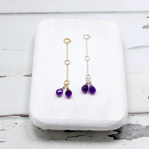 Gold and silver chain necklace extenders with purple amethyst gemstones, Creating a minimalist and elegant design.