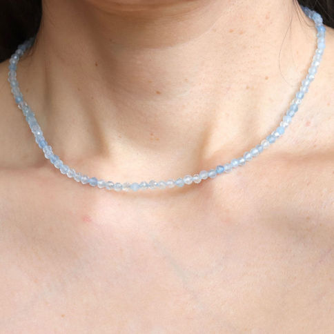 Natural 3mm Aquamarine spiritual necklace on skin. Authentic .925 Sterling Silver and 14k Gold Filled options. Shokoro.