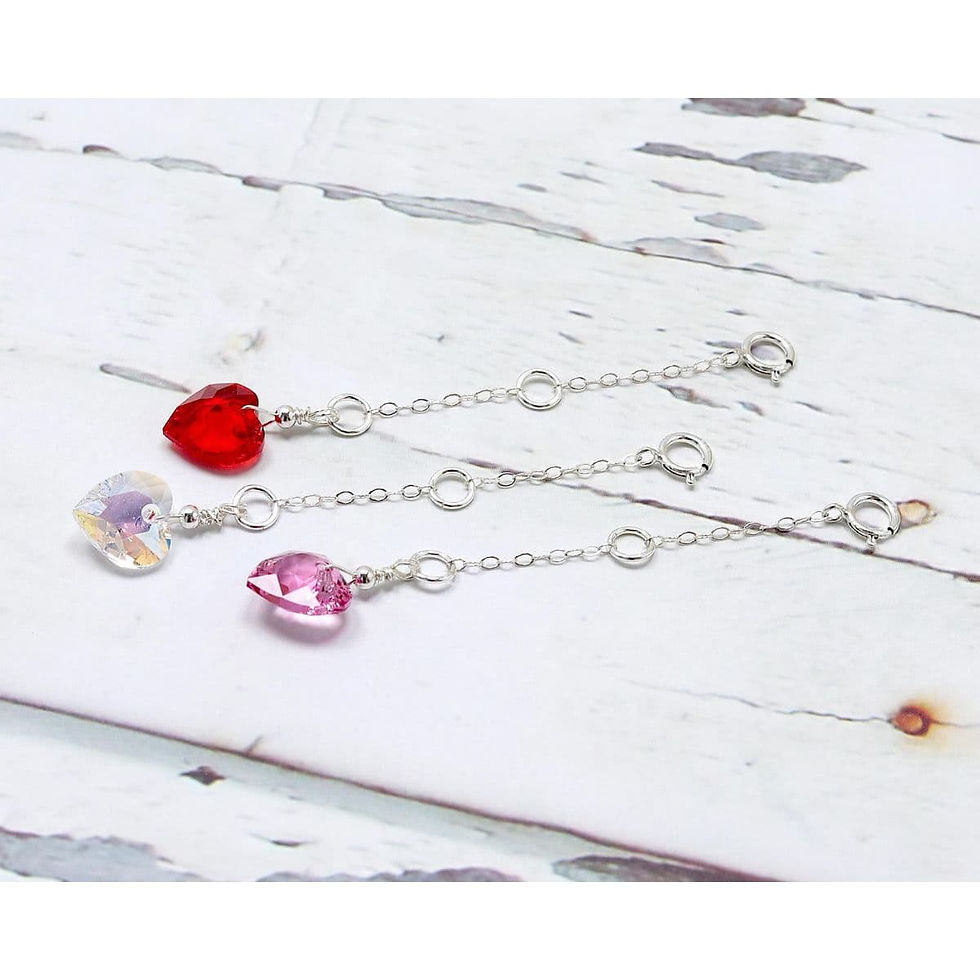 Three 925 sterling silver necklace extender chains with heart-shaped Swarovski crystals in red, pink, and clear. Pretty charm