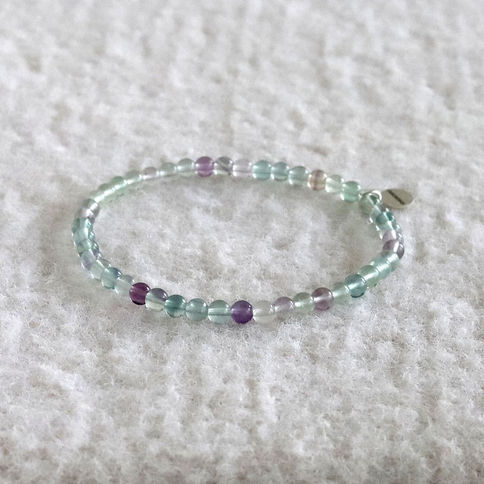 AAA Grade Rainbow Fluorite bracelet with sterling silver tag. High-quality purple and green crystal jewelry Toronto.