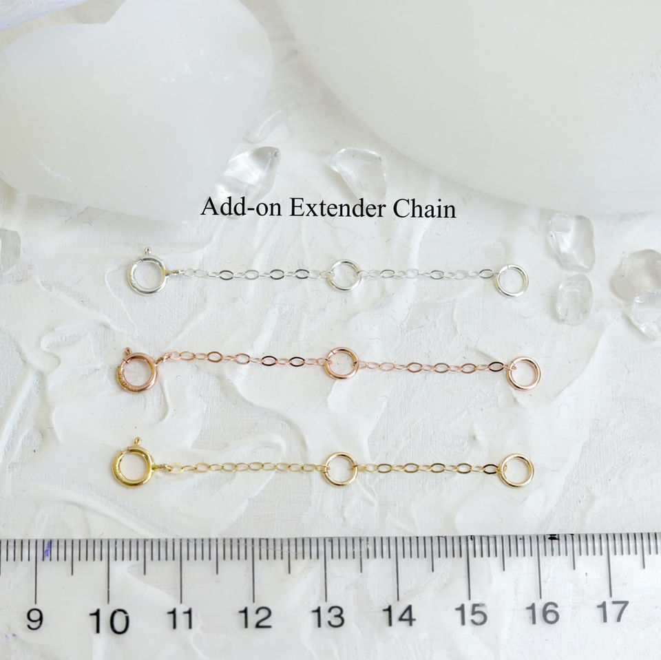 Three add-on high quality necklace extender in silver, rose gold, and gold are displayed on textured white background.