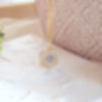 Gold evil eye pendant on a delicate 14k gold filled chain, handcrafted protection necklace in Toronto.