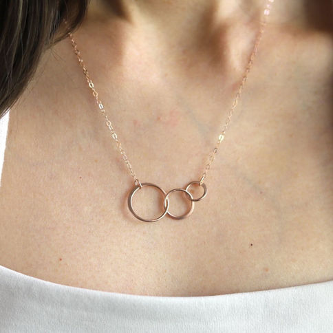 Dainty rose gold interlocking circle necklace shown from the front to highlight the elegant, high-quality finish by Shokoro