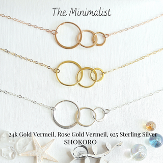 The Minimalist Choker Necklace, triple circle pendant which is called generation charm in high quality gold vermeil. unusually beautiful colour rose gold and sterling silver , each circle is half hammered texture sold at shokoro handmade, online minimalist jewelry brand