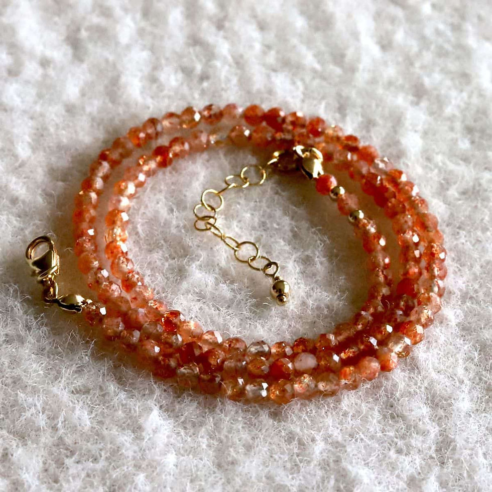 Close-up of sparkling Sunstone beaded necklace in 14k gold filled, adjustable handmade piece from Shokoro in Canada.