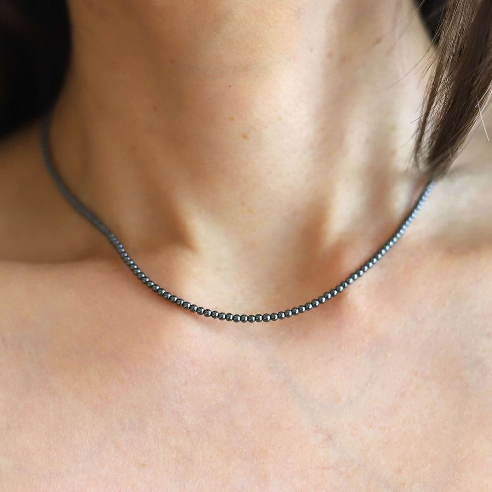 Model wearing a 2mm smooth Hematite beaded necklace, showing craftsmanship and metallic gemstone for quiet luxury styling.