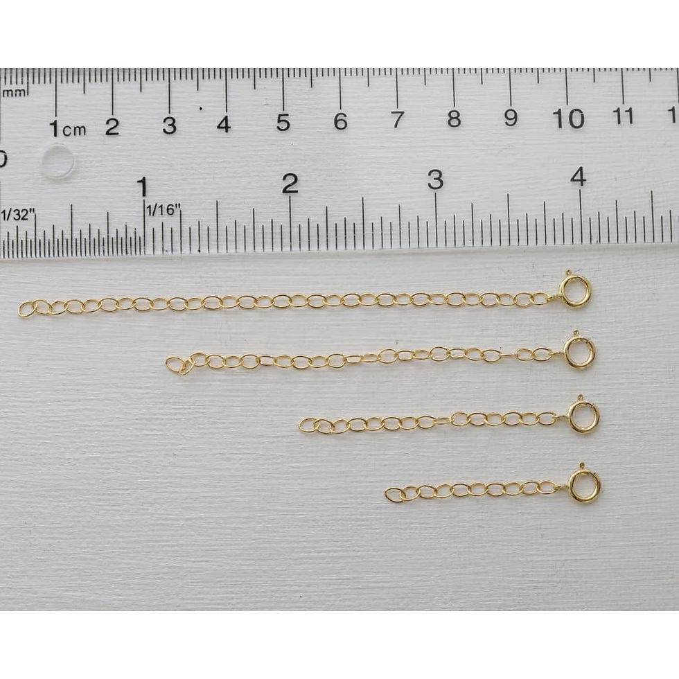 4 lengths of jewelry extender in 14k gold filled next to ruler to show the difference, styling minimalist layered styling.