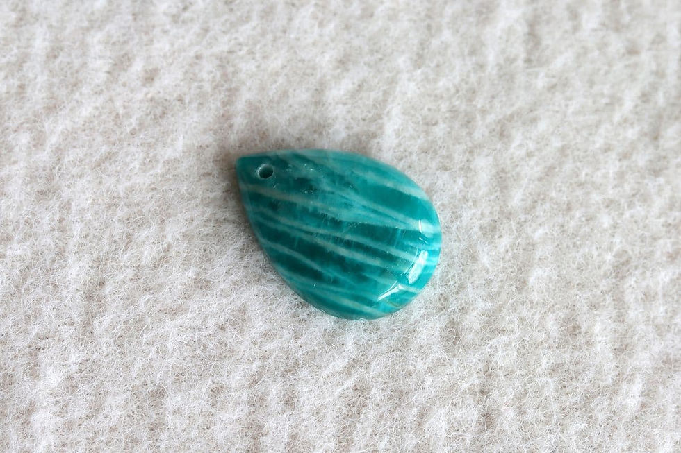 Genuine teardrop Amazonite stone from the Shokoro private collection, illustrating the natural healing possibilities of Amazonite.

