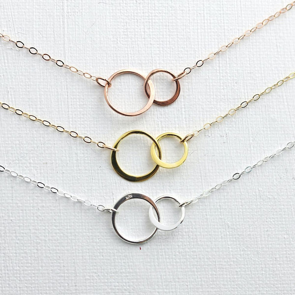 Double circle necklace in 14k gold-filled, rose gold-filled and sterling silver by Shokoro Handmade, symbolizing love bond.