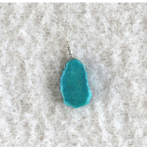 Vibrant blue Turquoise slice on a dainty sterling silver chain, showing artisan and natural inclusion details.