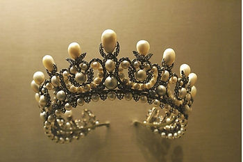 Elegant antique crown made with wire and white pearls, featuring jewelry used in ancient history.