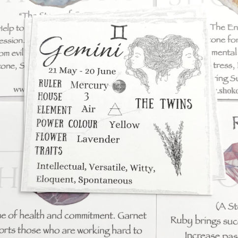 Video of gold zodiac constellation necklaces with natural gemstone birthstone cards and zodiac traits cards.