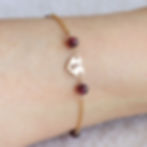 Customized Capricorn birthstone bracelet on wrist. Boss-core 14k gold filled jewelry, handcrafted by Shokoro Toronto.