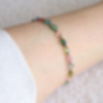 Wearing a rare Multi-Color Tourmaline oval bracelet. Minimalist candy-colored crystal jewelry for happiness and quiet luxury