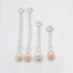 Four high luster pearl necklace extender chains each with a white or pink pearls, handcrafted for layering quiet luxury style