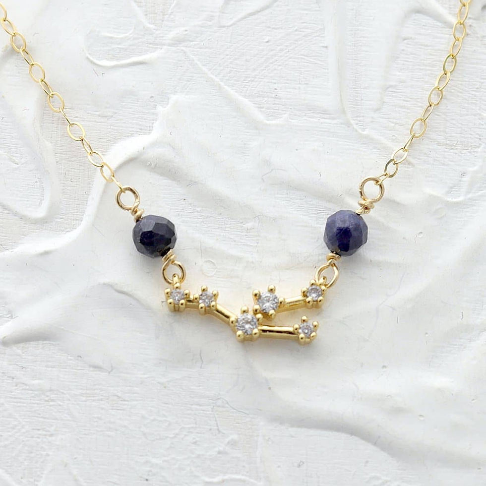 Taurus zodiac constellation necklace on a dainty gold-filled chain. Clean, minimalist view, personalized birthstone gift.