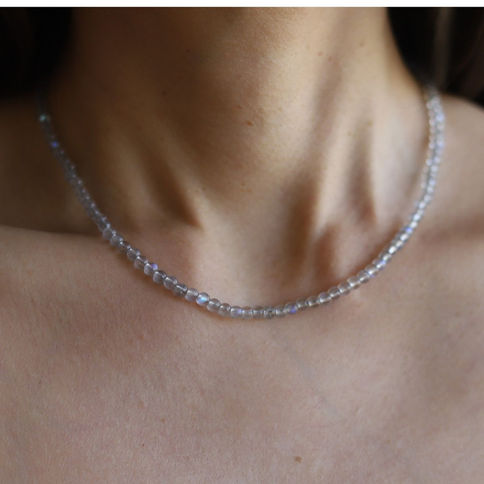 Model wearing natural Labradorite beaded necklace, high clarity gemstones, showing craftsmanship and everyday luxury style.