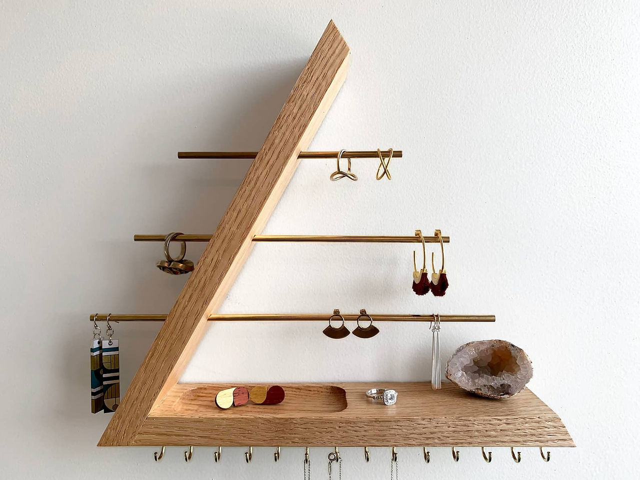 Wall mounted organizer for necklaces, earrings, rings, and bracelets
