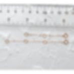 Two rose gold filled necklace extender chains next to ruler to show actual length