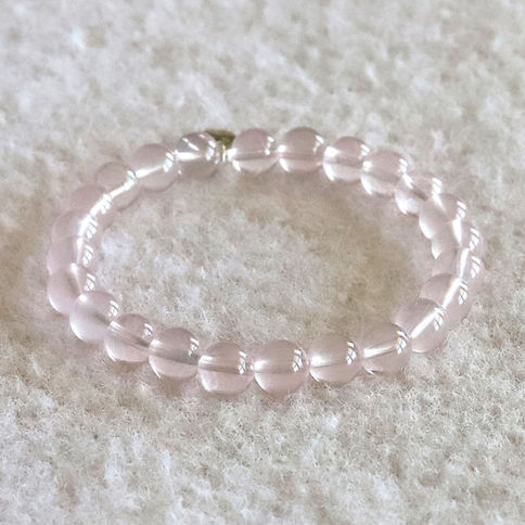 Translucent Rose Quartz healing bracelet. Minimalist high-quality crystal jewelry handcrafted in our Ontario studio.