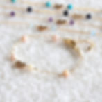 Close-up of customized Libra zodiac station bracelet with secure clasp. High-quality Pink Opal jewelry handcrafted in Canada.