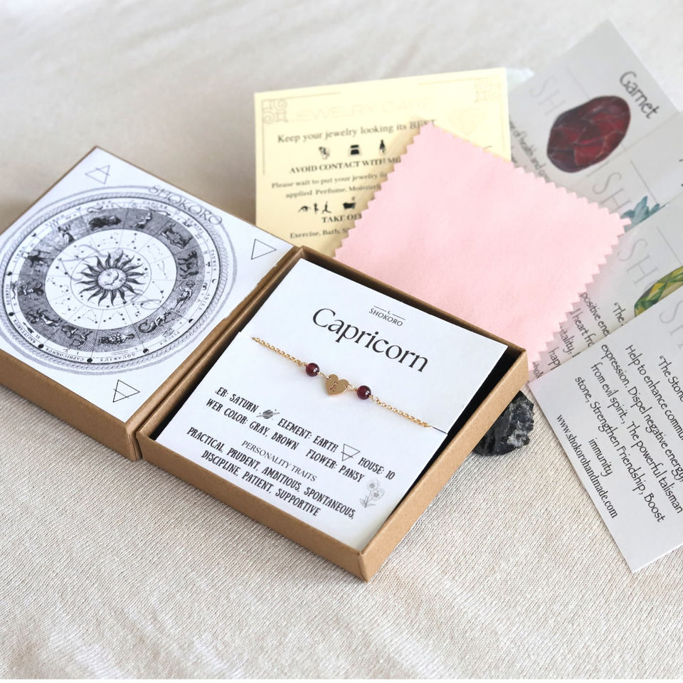 Personalized Capricorn zodiac birthstone gift box with meaning card. Soulful Earth sign jewelry by Shokoro Handmade.