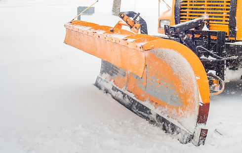 Snow plow doing snow removal after a blizzard in Chicago suberb..jpg